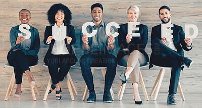 Buy stock photo Shot of a group of businesspeople each holding a letter that spells 