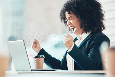 Buy stock photo Shot of an attractive young businesswoman sitting alone in the office and feeling angry while using her laptop