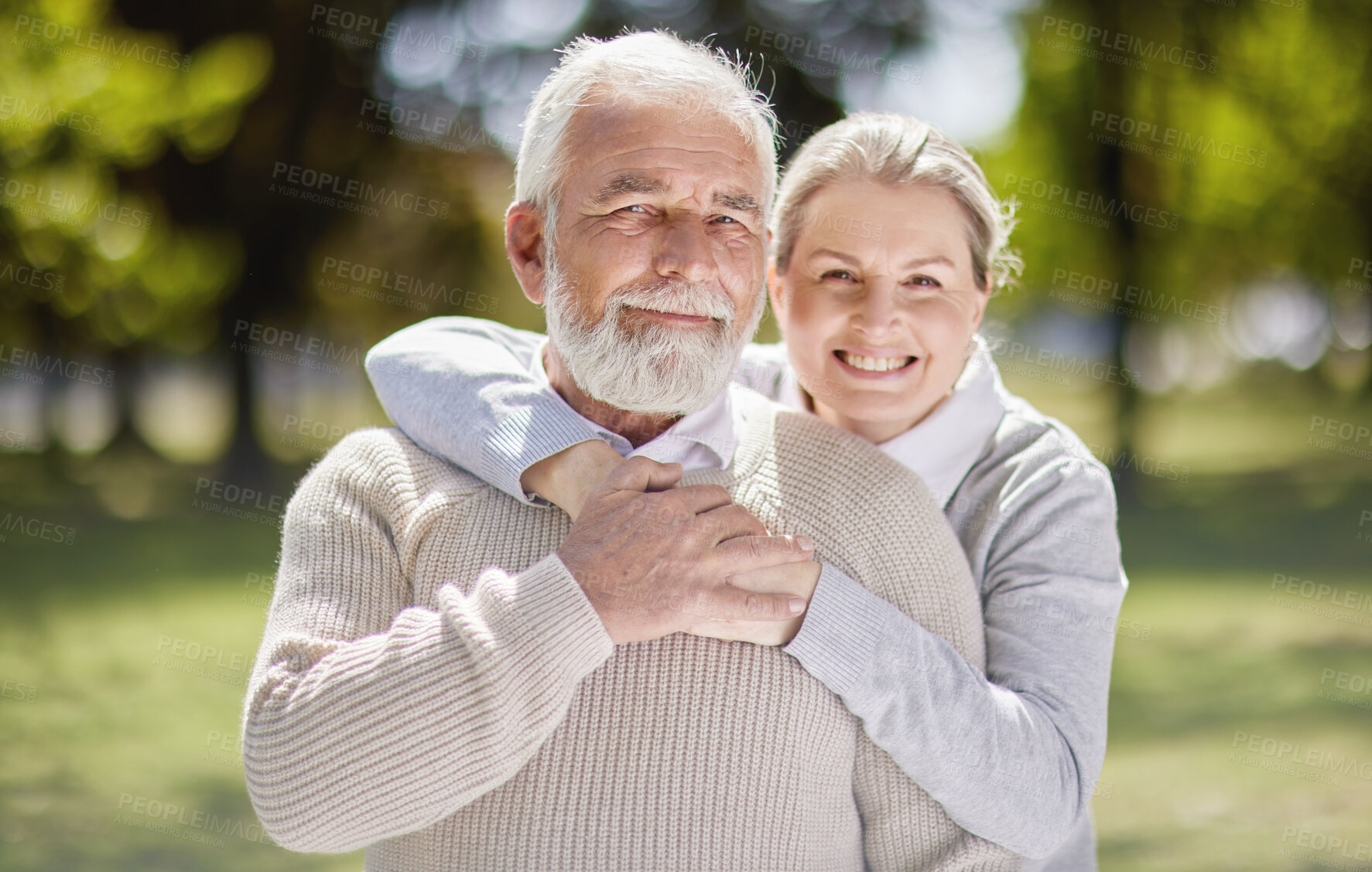 Buy stock photo Old couple hug in park with love and smile in portrait, retirement together with trust and support with care. Elderly man, woman and marriage with commitment, relationship and happy people outdoor