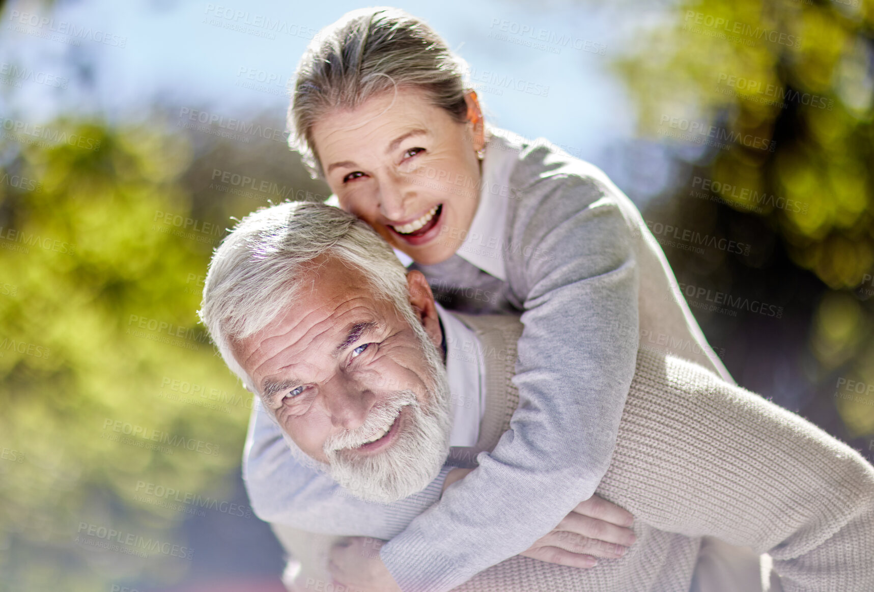 Buy stock photo Portrait, senior couple and piggyback in garden for care, support and happy for retirement. Woman, man and love in nature or park for holiday or vacation and weekend in countryside for summer