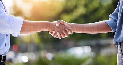 Buy stock photo Shot of two unrecognizable people shaking hands outside