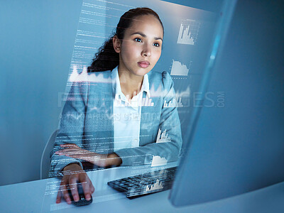 Buy stock photo Shot of an attractive young businesswoman sitting alone in the office and using her computer