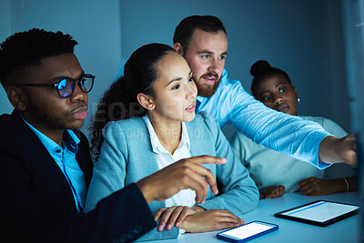 Buy stock photo Shot of a diverse group of businesspeople using a computer in the office