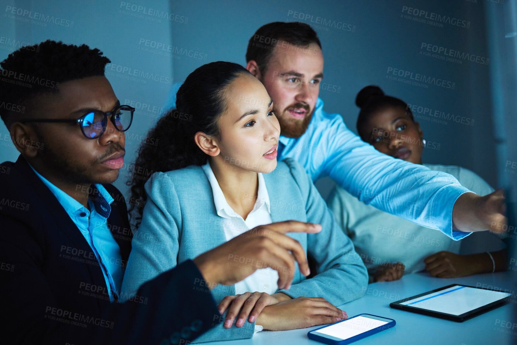 Buy stock photo Office, teamwork for diversity for colleagues, dark and technology for collaboration on project. Tablet, smartphone and discussion or planning on computer, digital agency and cybersecurity at desk