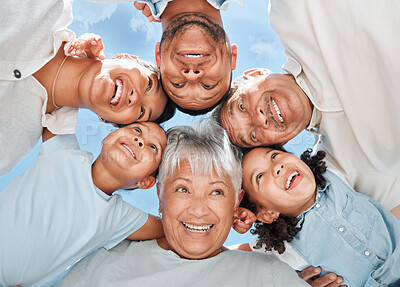 Buy stock photo Shot of a multi-generational family standing together in a huddle