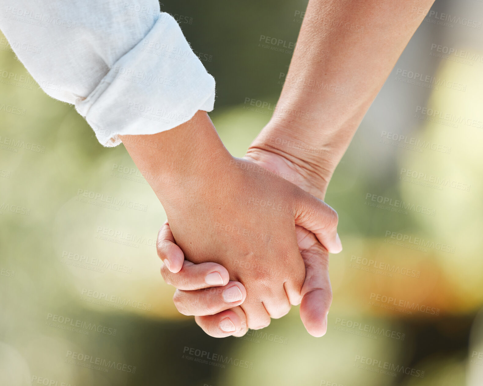 Buy stock photo Love, trust and holding hands with couple in nature for respect, gratitude and marriage. Community, support and faith with closeup of people in garden for partnership, solidarity or romance together