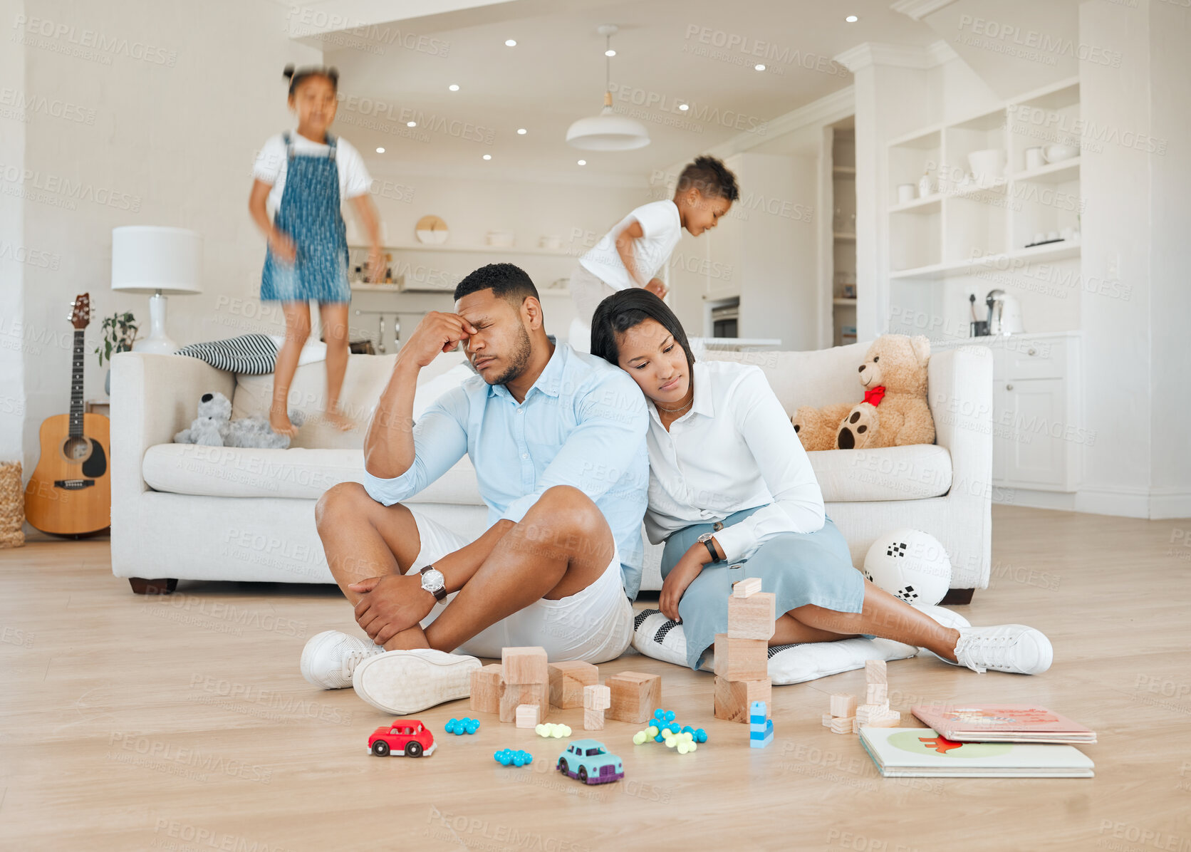 Buy stock photo Chaos, running and parents with stress, kids and tired with burnout, anxiety and noise in home living room. Mother, father and energetic children in lounge with adhd, fatigue and motion with headache