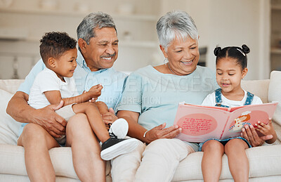 Buy stock photo Shot of grandparents bonding with their grandchildren on a sofa at home