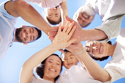 Buy stock photo Shot of a family stacking their hands outside