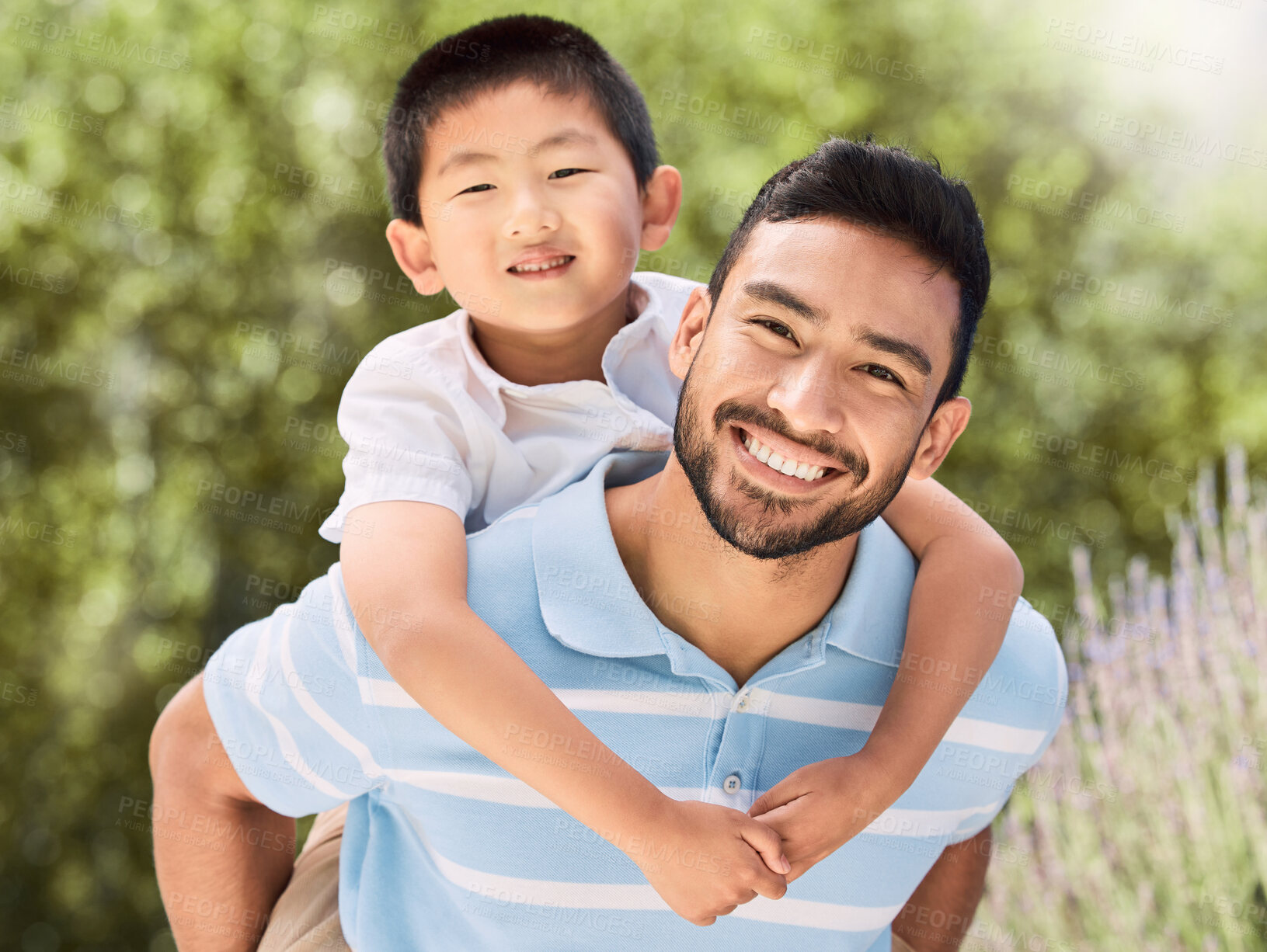 Buy stock photo Shot of an adorable little boy and his father having a fun day at the park