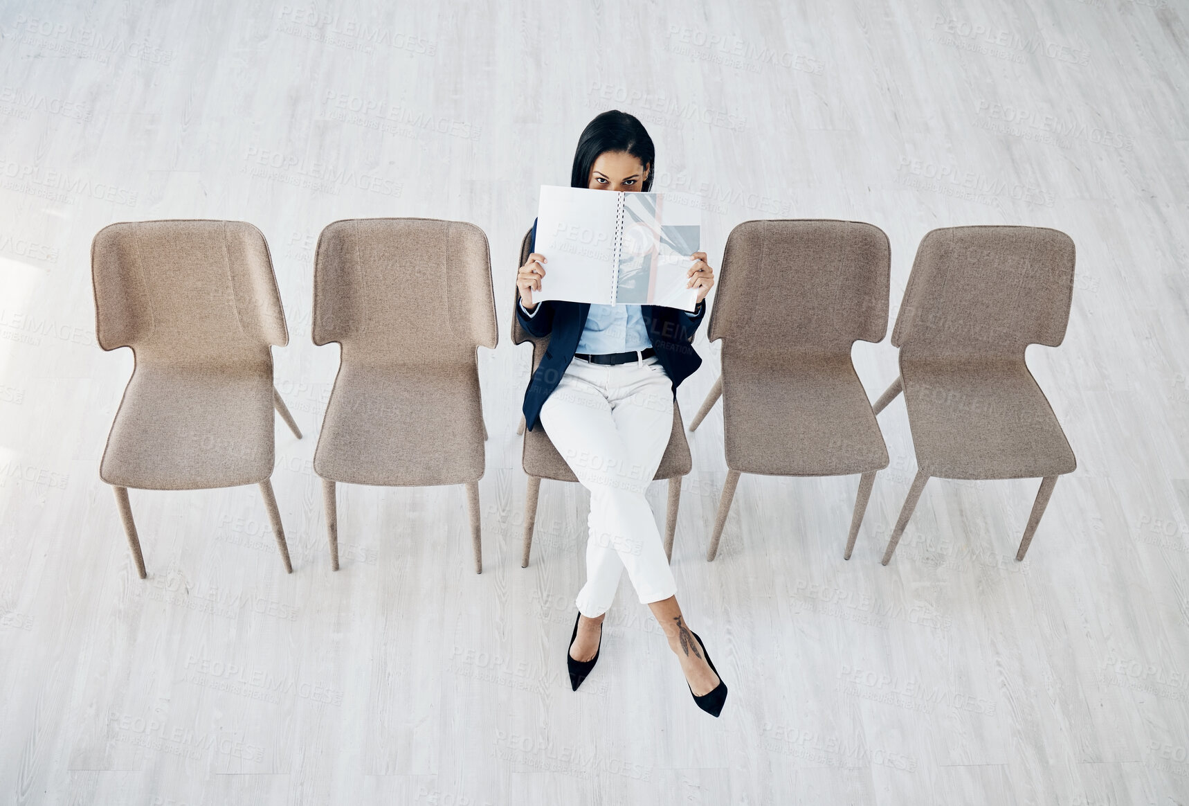 Buy stock photo Business woman, waiting room and reading on chairs for interview, hiring or recruitment at office. Portrait of female person or employee sitting for appointment, meeting or career opportunity in line