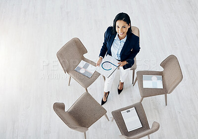 Buy stock photo Business woman, meeting and empty waiting room with documents on chair above in team appointment at office. Top view of female person or employee with paperwork in hiring or social group at workplace