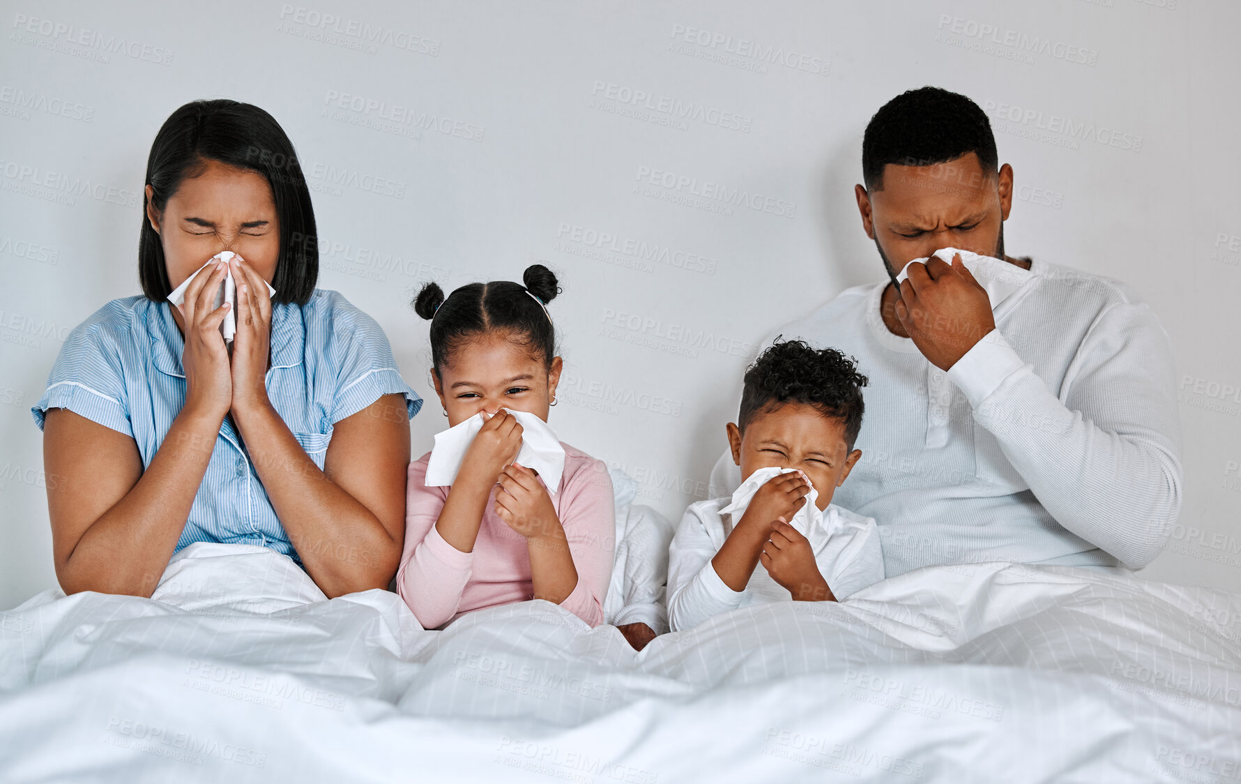 Buy stock photo Family, sick and blowing nose in bed with flu, allergies and common cold in bedroom. Parents, children and tissues at home for recovery, congestion and contagious viral disease or covid 19 symptoms