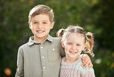 Buy stock photo Shot of an adorable little boy and girl standing outside