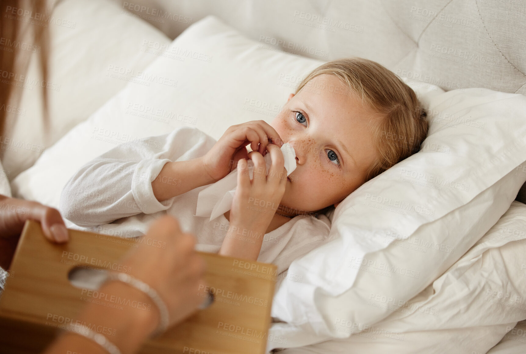 Buy stock photo Sick, child and parent at bed in home for healthcare, wellness or tissue for cold treatment. Health, person and girl blowing nose for flu, virus or infection in bedroom with care, comfort and support