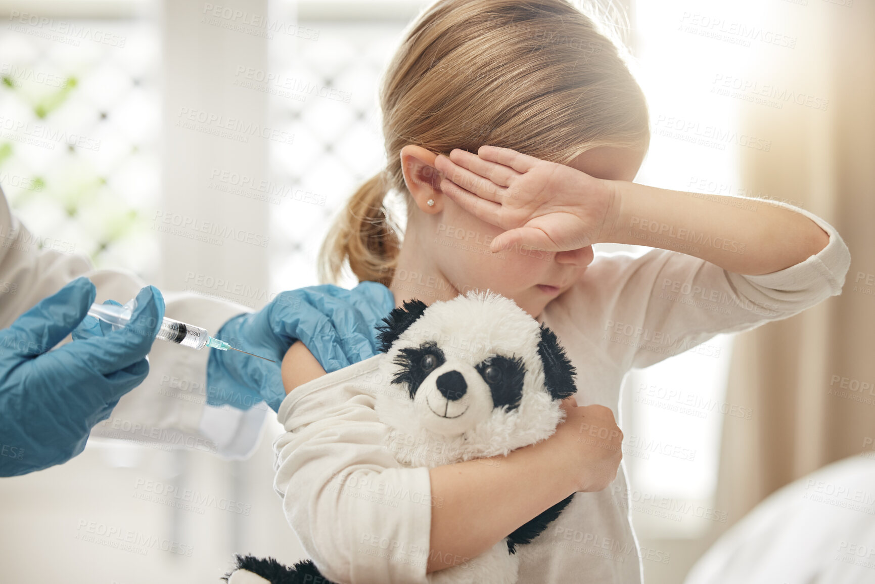 Buy stock photo Scared girl, needle and injection with doctor for vaccine, cure or healthcare checkup at hospital. Little child, female person or young kid afraid of syringe for immunity, antibiotic or jab at clinic