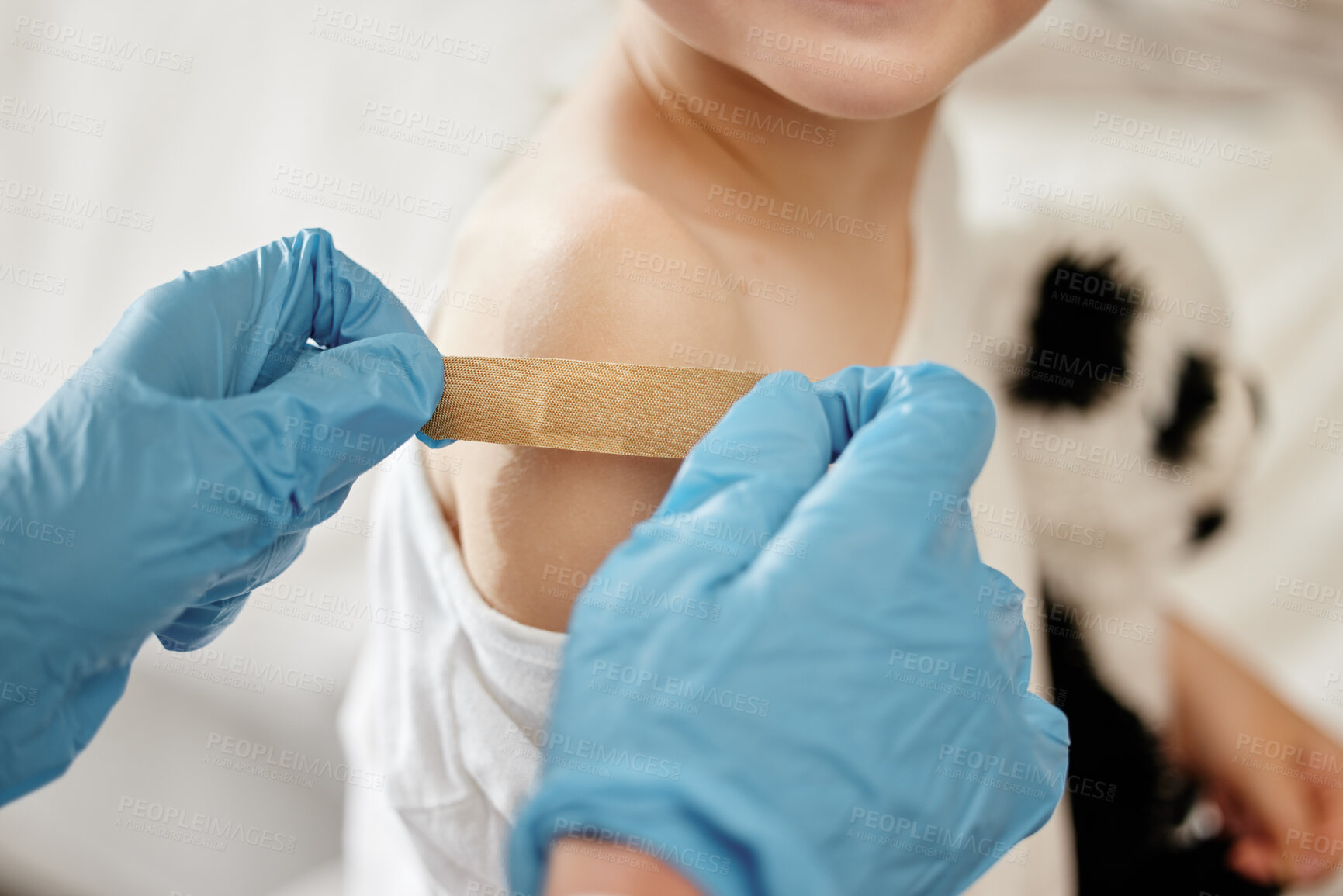 Buy stock photo Hands, doctor and child with bandage for injection, healthcare and help with support in hospital. Pediatrician, kid and patient with plaster for polio vaccine, services or gloves for safety in clinic