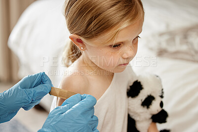 Buy stock photo Shot of an unrecognizable doctor applying a cotton ball to a patient's arm at home