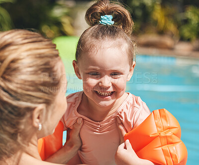 Buy stock photo Learning, happy and child with swimming instructor in pool for lesson, education or practice in summer. Sweet, outdoor and teacher with girl kid in water for aquatic exercise, growth or development.