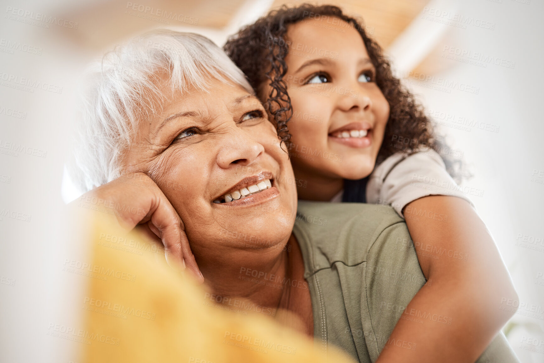 Buy stock photo Shot of a grandmother spending time with her grandchild at home