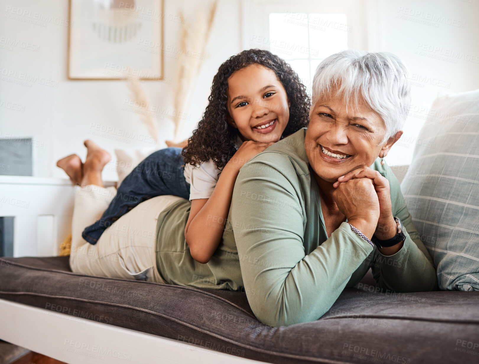 Buy stock photo Shot of a grandmother spending time with her grandchild at home