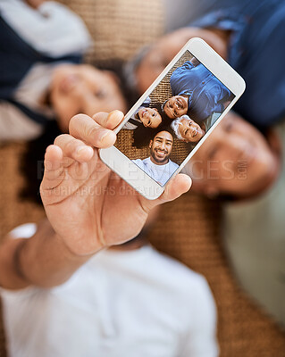 Buy stock photo Happy family, phone screen and selfie for social media, online post or vlog on floor together at home. Top view of Grandparents, father and child smile for photo, memory or profile picture in house