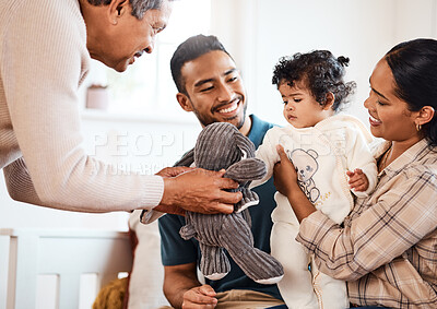 Buy stock photo Shot of a young family spending time together at home