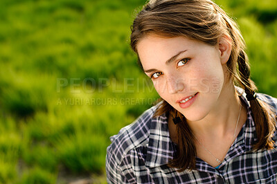 Buy stock photo Woman, portrait and wellness in grass field for spring with happiness, flowers and relax. Female gen z person, rest and fresh air with smile by countryside for weather, farm environment and sunshine