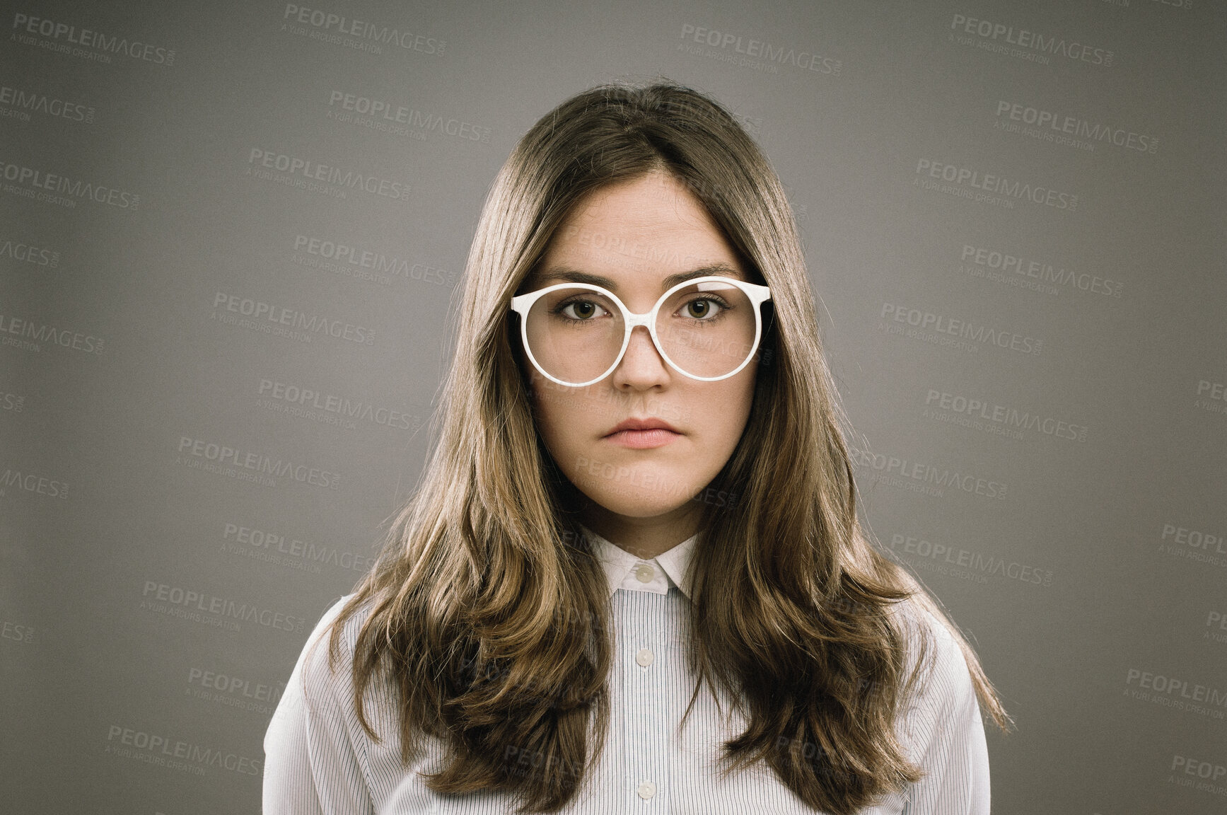 Buy stock photo Glasses, hair and portrait of girl geek in studio on gray background for accessories or fashion. Face, intelligence and vision with cute nerd or natural person in eyewear for retro or vintage style