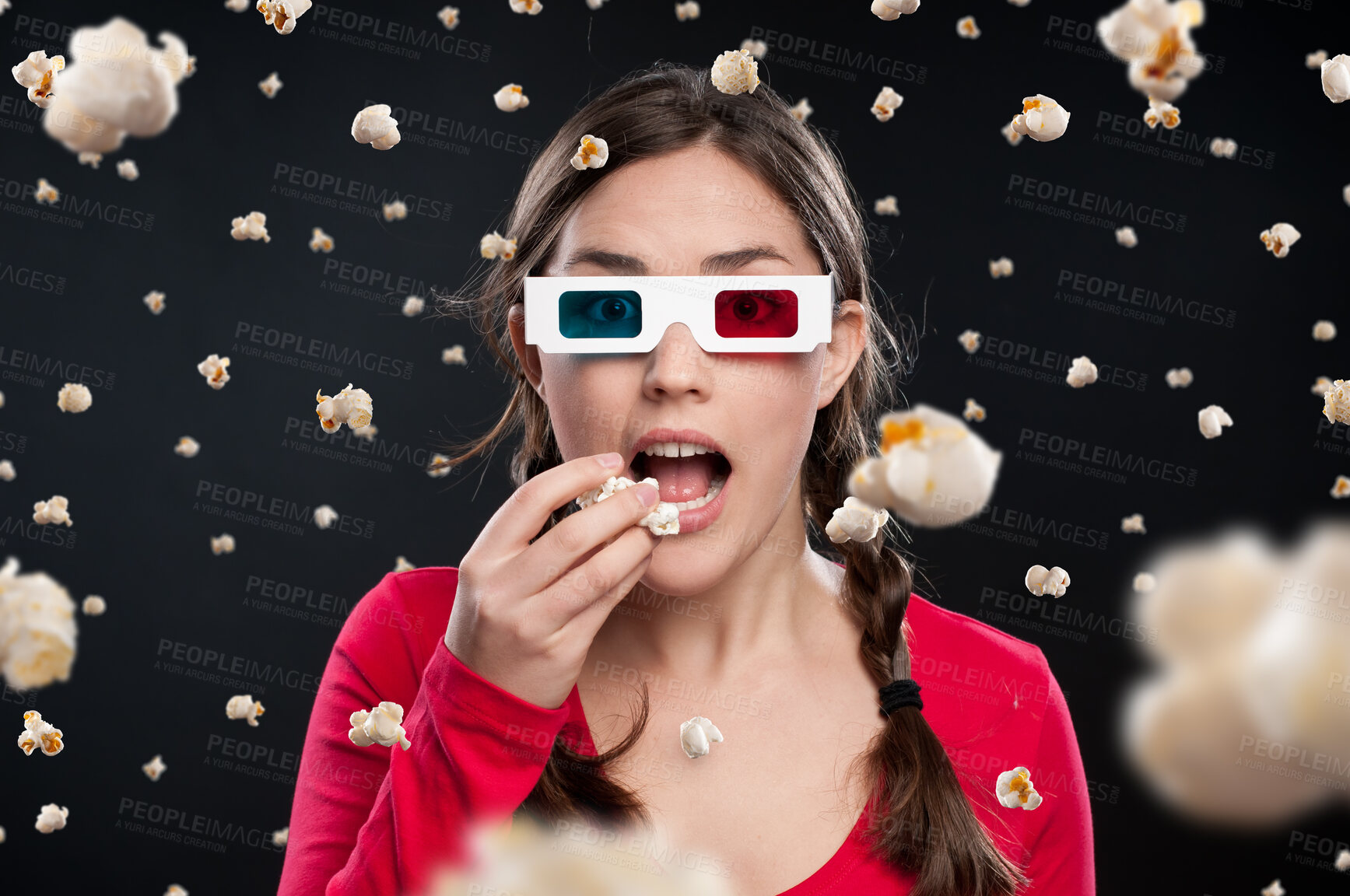 Buy stock photo Girl, 3d glasses or levitation of popcorn while eating, watching movie or horror by dark background. Fantasy, face or female person with shock in studio for mystery, film or color lenses with mockup