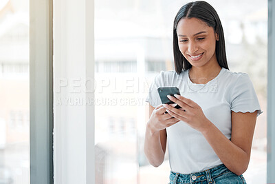 Buy stock photo Reading, woman and smartphone by window in office for social media, communication or marketing for company. Creative businessperson, happy and text in workplace for networking, technology or contact