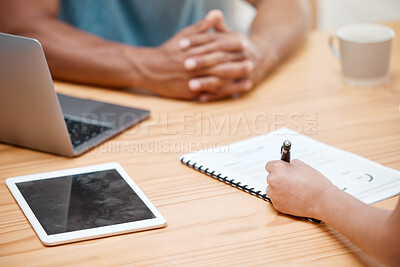 Buy stock photo Shot of an unrecognisable woman sitting with her rental agent and signing a lease agreement