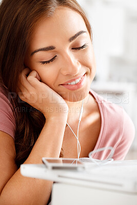 Buy stock photo Happy woman listening to music on smartphone, streaming audio podcast and mobile app headphone technology. Young girl relaxing at home, online radio with calm face and internet user portrait alone