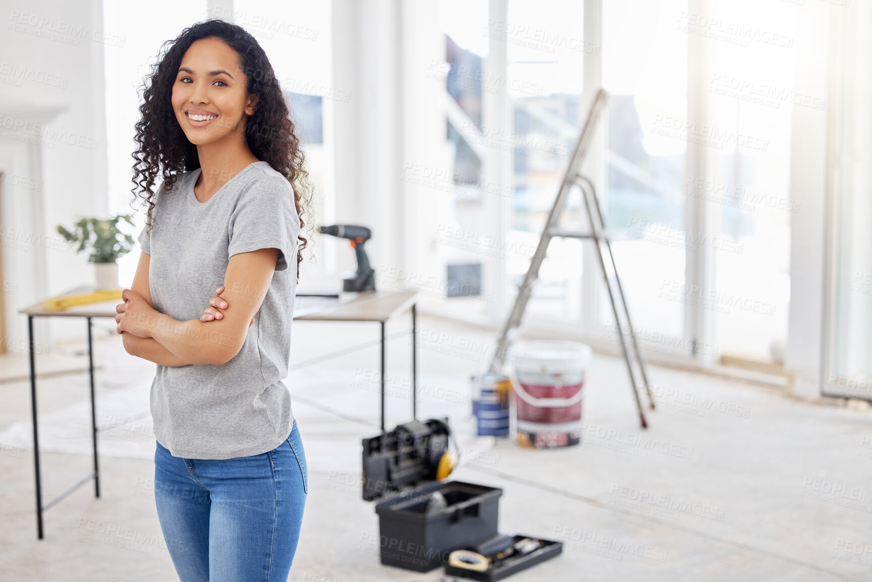 Buy stock photo Woman, portrait and arms crossed in project diy or home improvement as carpenter in house for renovation. Female person, construction tools and contractor in building for maintenance on property