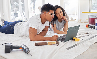 Buy stock photo Laptop, thinking and renovation a couple in their new home together for a remodeling project. Construction, real estate or diy property maintenance with a man and woman planning in their house