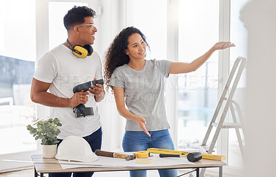Buy stock photo Maintenance, planning and diy with a couple in their new house together for a remodeling project. Construction, real estate or property renovation with a man and woman bonding over home improvement