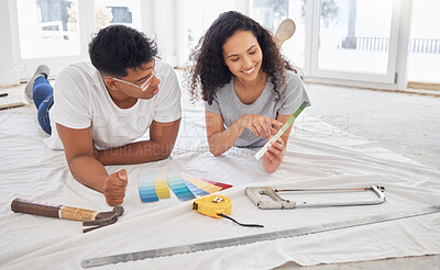 Buy stock photo Paint, renovation and decision with a couple in their new house together for remodeling project. Construction, real estate or property improvement with a man and woman choosing a color at home