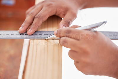 Buy stock photo Cropped shot of a carpenter doing measurements on wood