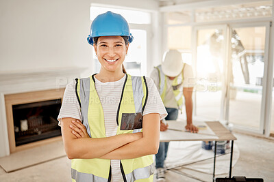 Buy stock photo Portrait of woman, construction and home renovation with arms crossed, helmet and smile in apartment. Yes, positive mindset and renovations, happy female in safety and building project in new house.