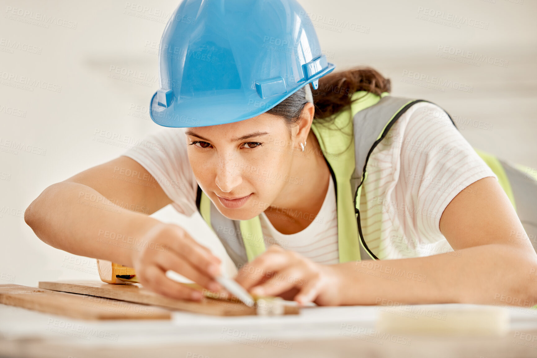 Buy stock photo Construction, woman and plank on table to measurement, accuracy and check size for inspection. Architecture, contractor and blueprint for floor plan, equipment and renovation project in office