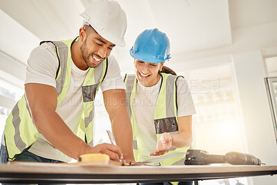 Buy stock photo Engineer, construction and team working at table for maintenance, architecture or carpentry. Man and woman talking, laughing and writing or measuring with handyman tools for teamwork and planning
