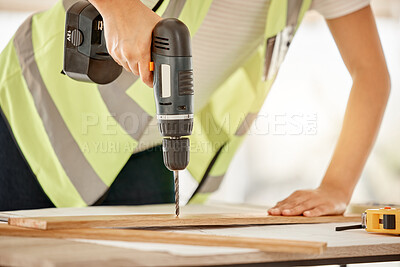 Buy stock photo Wood, construction and carpenter hand with a drill for repair, renovation or building. Hands of contractor, carpenter or technician person with electric power tools for furniture project in workshop