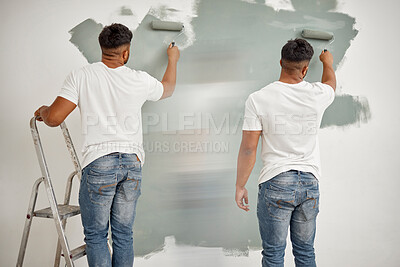 Buy stock photo Composite shot of a man painting a wall at home