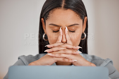 Buy stock photo Shot of a young businesswoman suffering from a headache at work