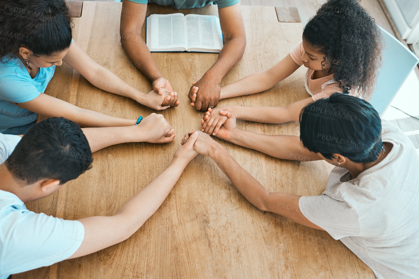 Buy stock photo Religion, family and holding hands for prayer at table in home with worship, spiritual group or gratitude. Christian people, parents and children with bible for praise to God and thankful on top view