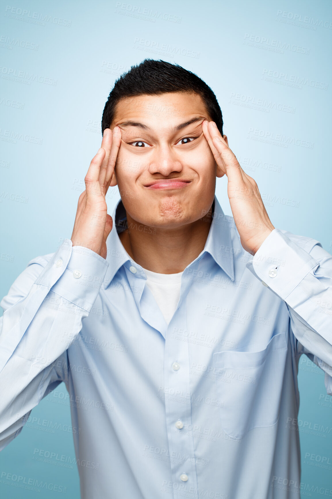 Buy stock photo Funny face, goofy and portrait of silly man in studio isolated on blue background for expression. Comedy, comic and humor with playful business person having fun or joking in shirt for fashion