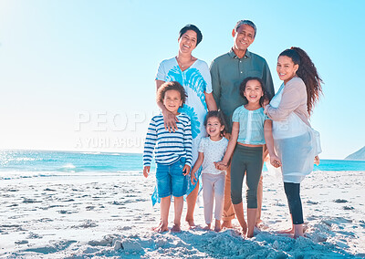 Buy stock photo Shot of a multi-generational family spending the day at the beach