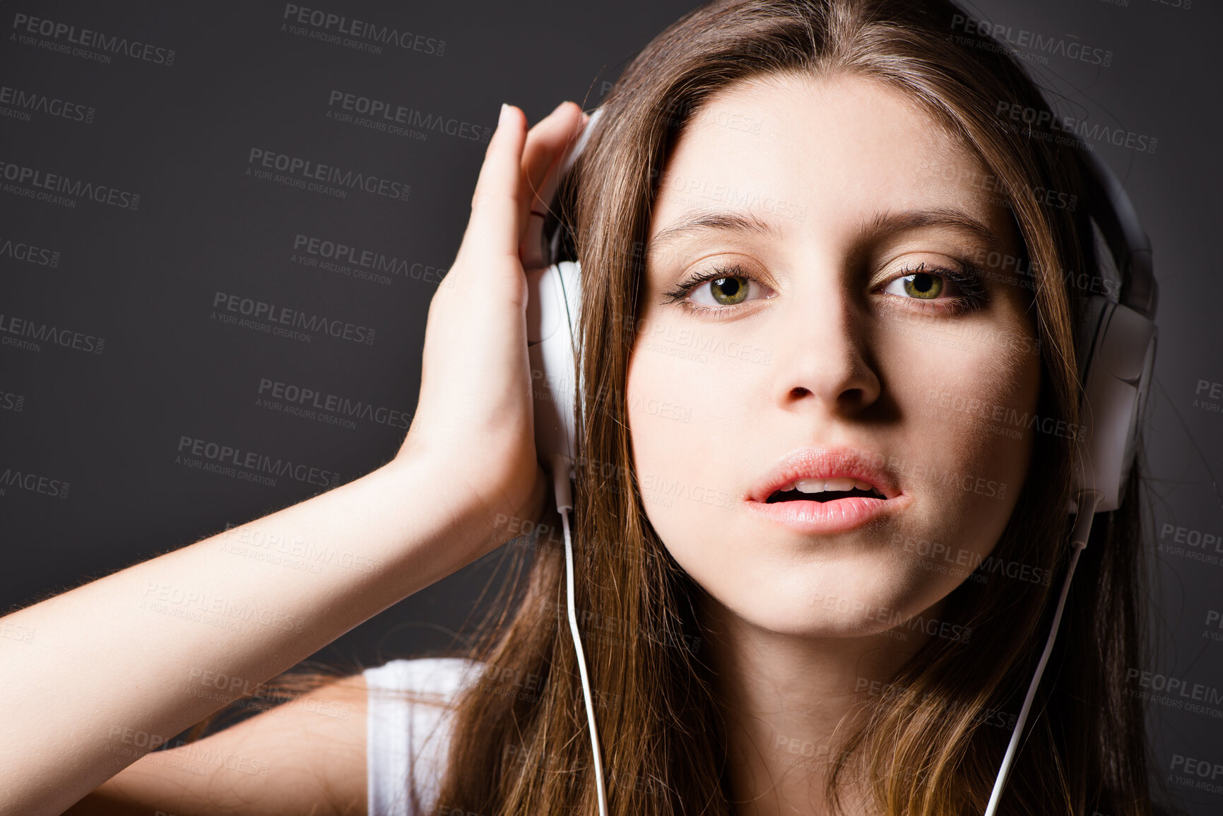 Buy stock photo Woman, portrait and headphones in studio for music listening or podcast, subscription or streaming. Female person, face and black background for online audio with media sound, radio or connection