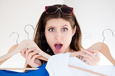 Buy stock photo Woman, portrait and hanger from shopping and surprise, deal or sale for fashion purchase. Wow, shock and promotion in store for female person, customer or retail for choice in boutique discount