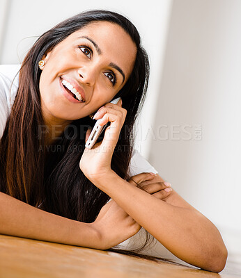 Buy stock photo Phone call, woman and talking to contact in home office for news, negotiation or communication. Smartphone, smile and  freelancer in conversation for gossip story, chat and listening to information